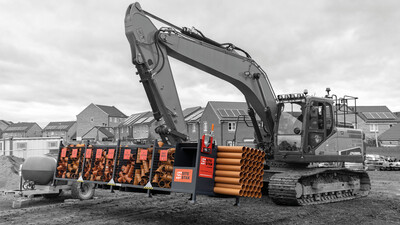 Excavator moving a SiteStak workstation